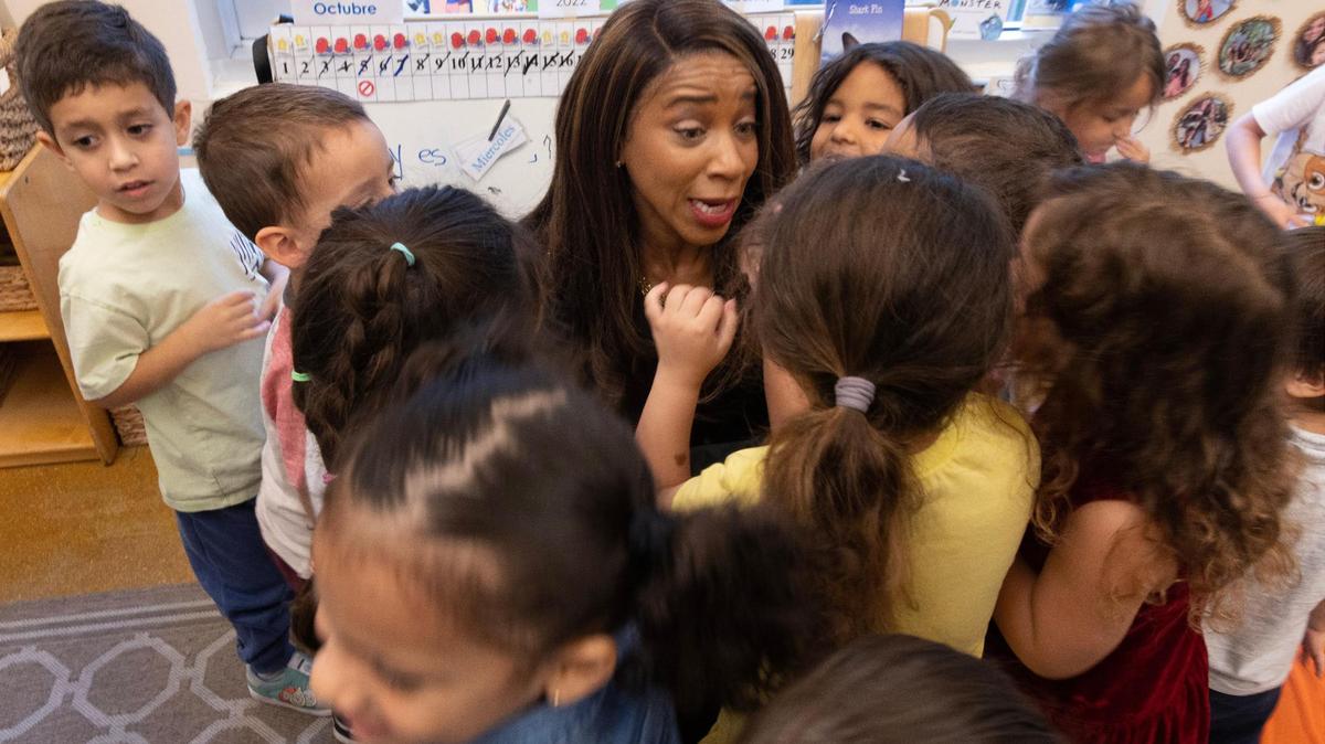 Symeria Hudson, the new CEO and president of United Way Miami, is surrounded by 3- and 4-year-olds after reading to the children at the United Way Center for Excellence in Early Education.