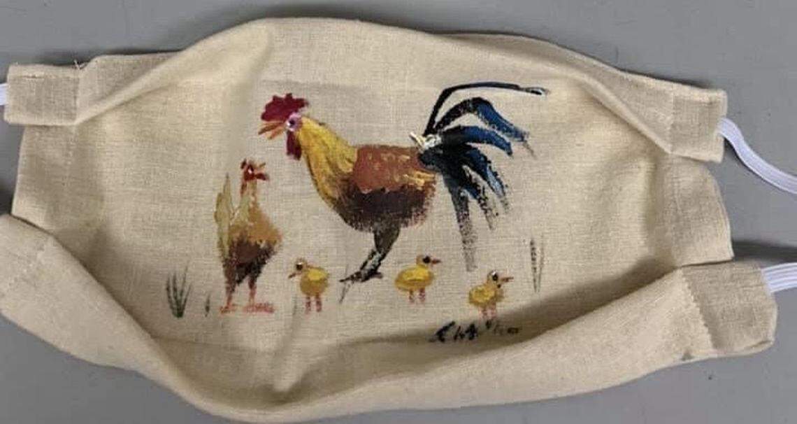 Key West artist Rick Worth painted some masks like this rooster one for an auction to raise money for the Sister Season Fund, which helps unemployed service workers pay the bills during the COVID-19 pandemic.