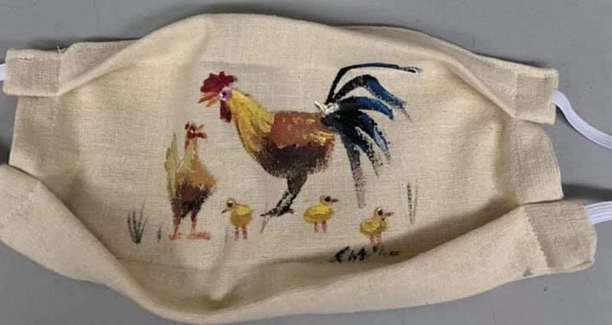 Key West artist Rick Worth painted some masks like this rooster one for an auction to raise money for the Sister Season Fund, which helps unemployed service workers pay the bills during the COVID-19 pandemic.