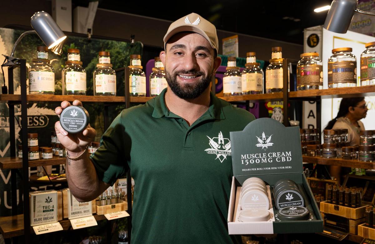 Tamer Altaweel, the CEO of HempWellness, holds some of his company’s products while attending the CHAMPS Trade Show at the Broward County Convention Center on Thursday, Oct. 17, 2024, in Fort Lauderdale, Fla.