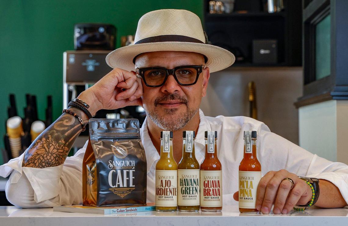 Daniel Figueredo co-owner of Sanguich, displays some of the brand’s new products, including hot sauce.