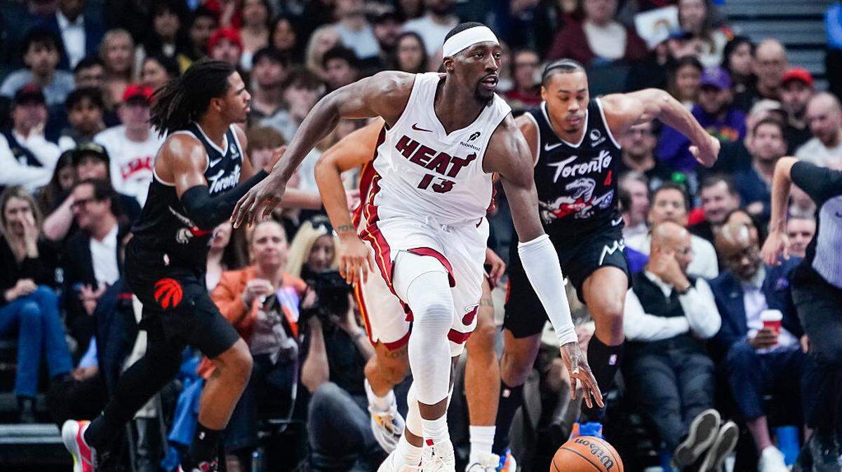 Bam Adebayo #13 of the Miami Heat dribbles against the Toronto Raptors during the first half at the Scotiabank Arena on April 9, 2026 in Toronto, Ontario, Canada.