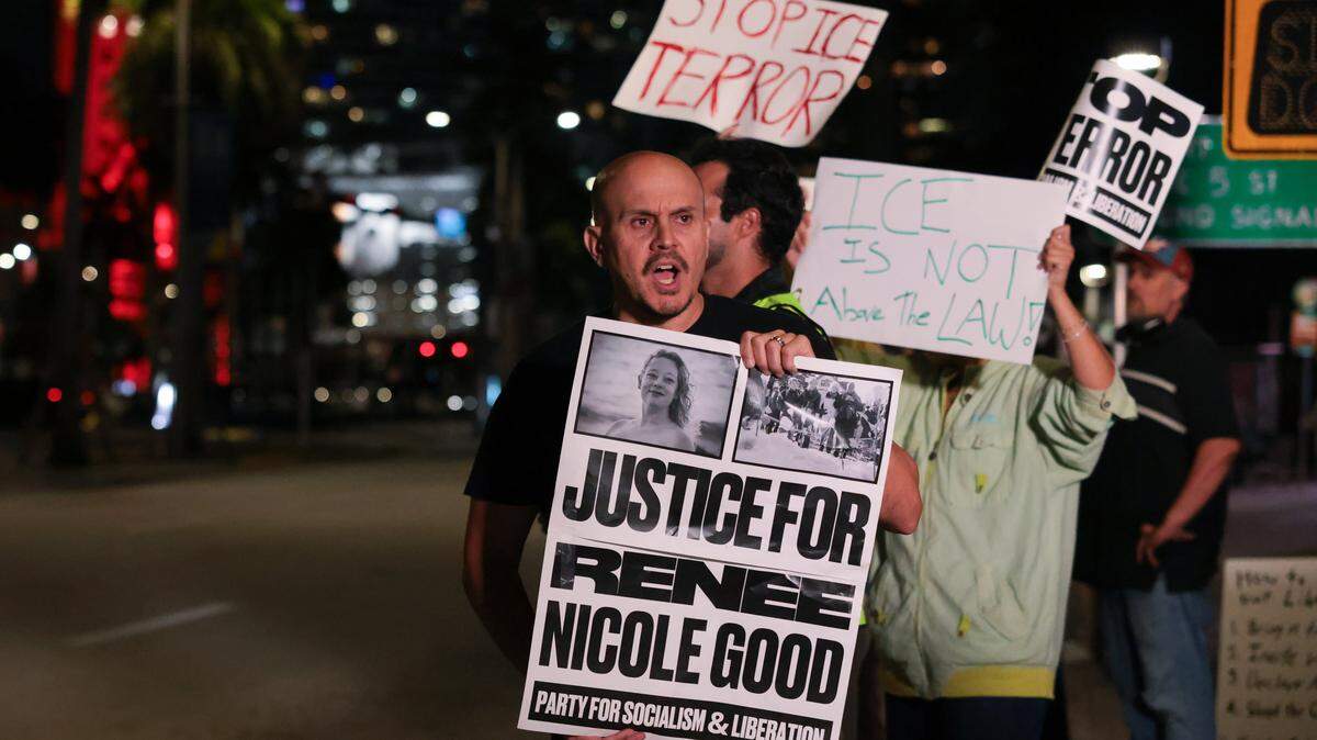 Jim Carles, a former Navy lieutenant commander, protests against ICE at the Torch of Friendship monument at 401 Biscayne Blvd., in downtown Miami on Wednesday, Jan. 7, 2026.