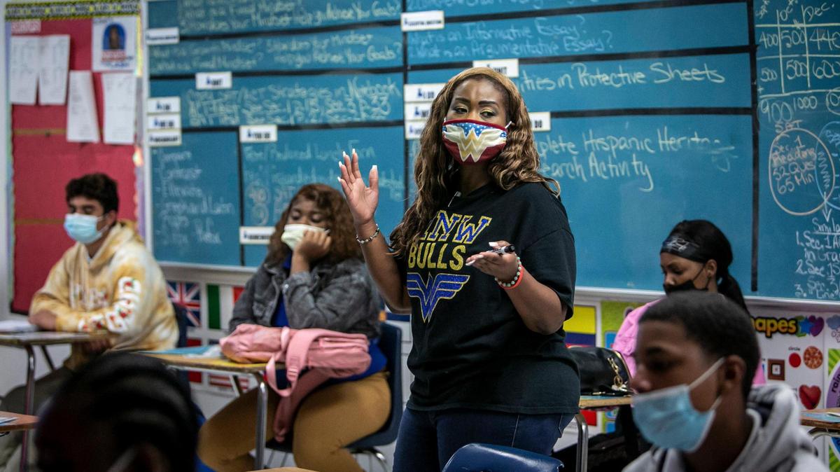 Dannielle Boyer, a teacher at Miami Northwestern High School, discusses what happened on 9/11 with her class. Boyer began her first day of teaching on Sept. 11, 2001, and taught sixth graders at Westview Middle School.