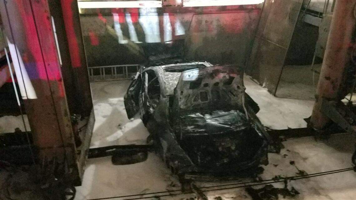 A car fell nine stories and burst into flames inside a parking garage in downtown Miami on Jan. 29, 2019.