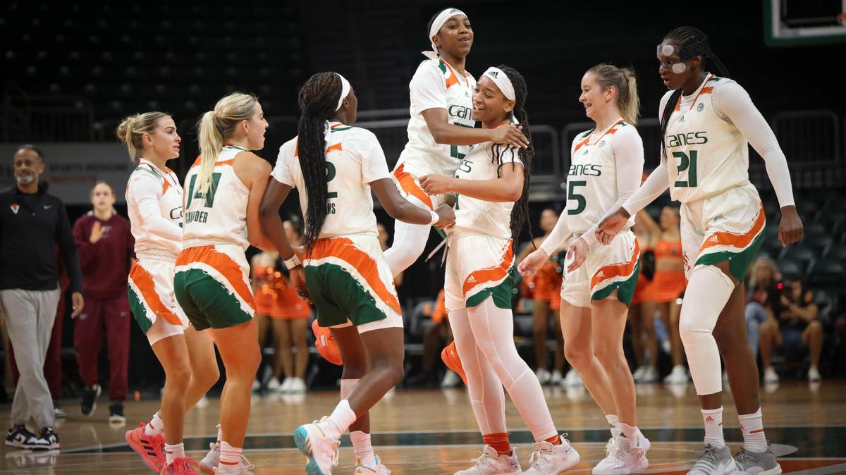 Hurricane’s Lashae Dwyer (13) congratulates Jasmyne Roberts (4) on a basket during the third quarter of the NCAA game between the University of Miami Hurricanes and Virginia Tech on Sunday, Jan. 8, 2023, at Watsco Center in Coral Gables. The Hurricanes won 77-66.