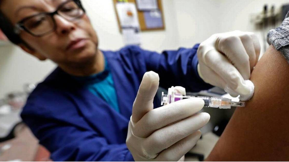A child gets a flu shot.