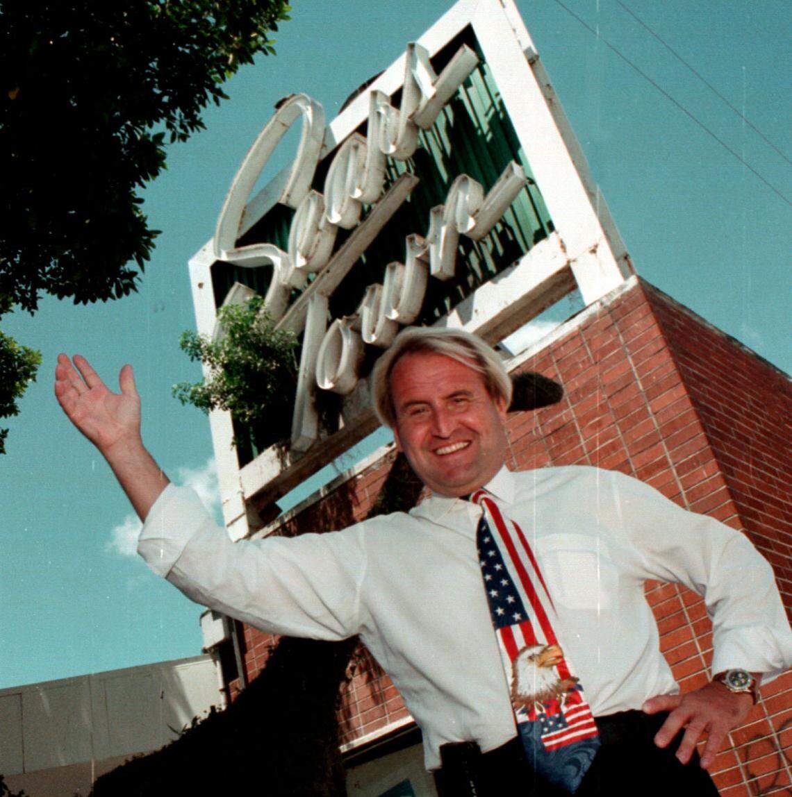 In this file photo from July 26, 1996, Lennard Blomkist, then the owner of Searstown at US 1 and Sunrise Blvd. in Fort Lauderdale, poses near the distinctive outdoor sign.