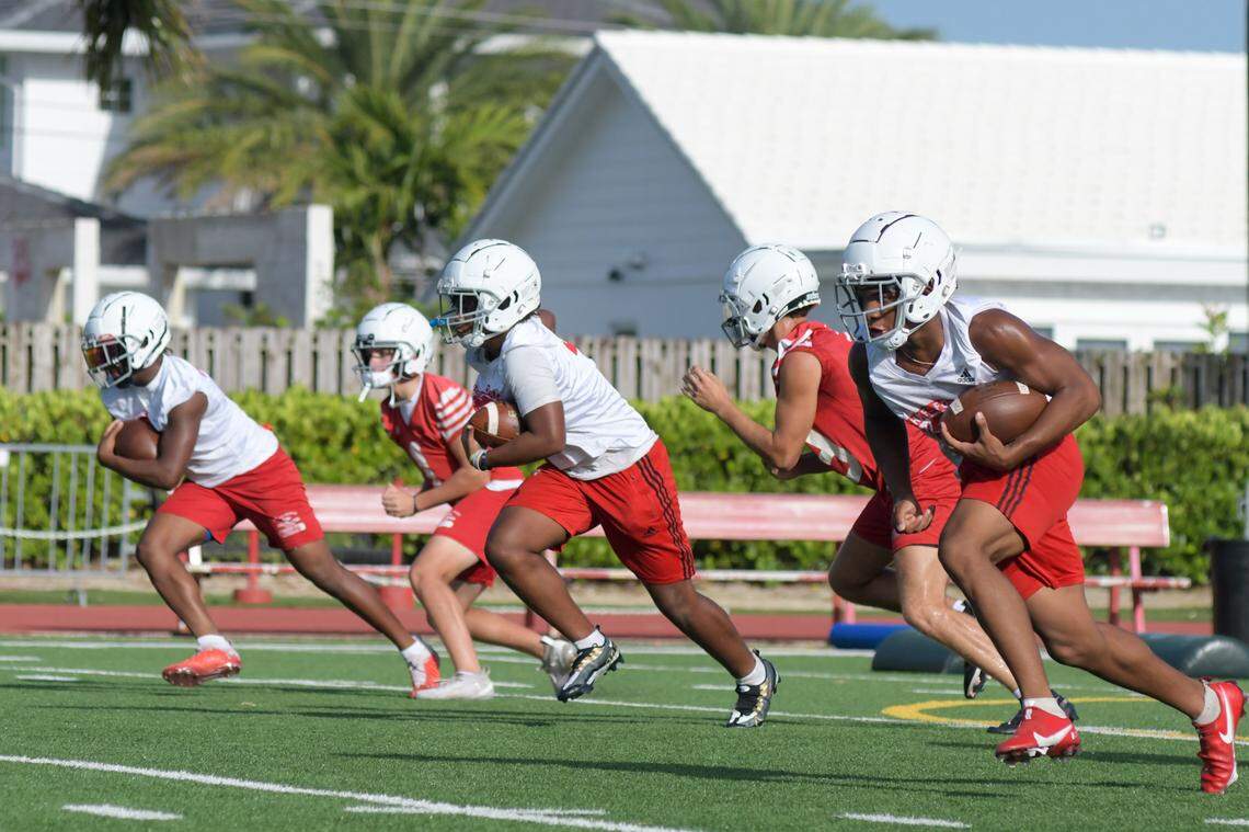 Cardinal Gibbons running backs go through a drill during practice on Monday, Aug. 1, 2021, at Cardinal Gibbons High School in Fort Lauderdale, Florida.