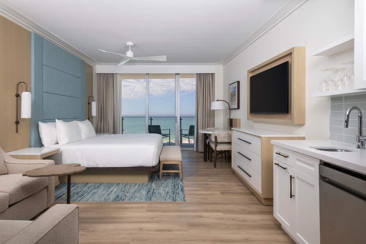 Every suite comes with floor-to-ceiling Gulf views, a roomy balcony and spa-like touches.