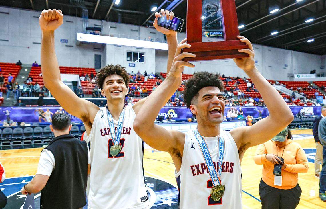 Columbus’ Cameron Boozer (12) and brother Cayden Boozer (2) celebrate after the team defeats Windermere for the FHSAA Class 7A Final for Boys High School Basketball State Championship.