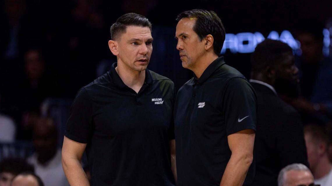 Miami Heat assistant coach Chris Quinn speaks with head coach Erik Spoelstra during the second half of an NBA game against the Washington Wizards at Kaseya Center on March 3, 2025, in Miami.
