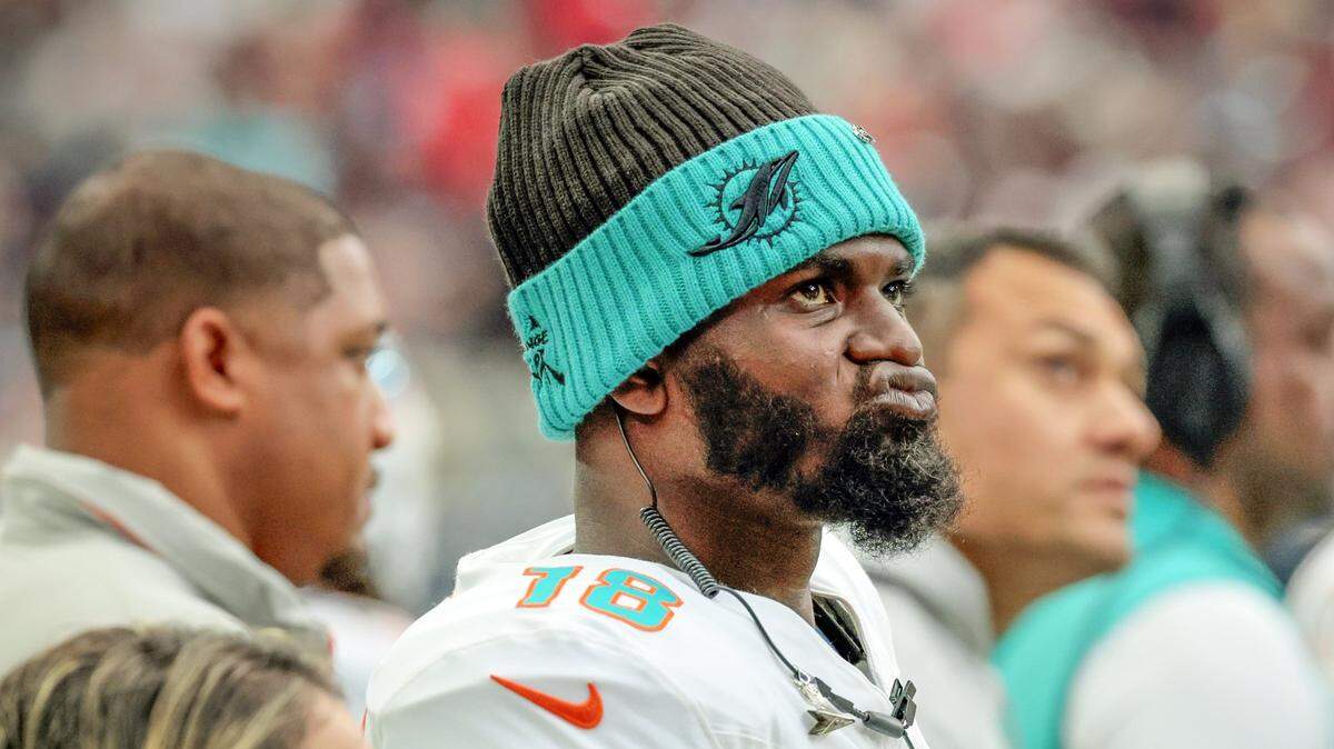 Miami Dolphins quarterback Tyler Huntley (18) watches the game from the sidelines in the first half of their NFL football game against the Houston Texans at NRG Stadium in Houston, Texas, on Sunday, December 15, 2024.