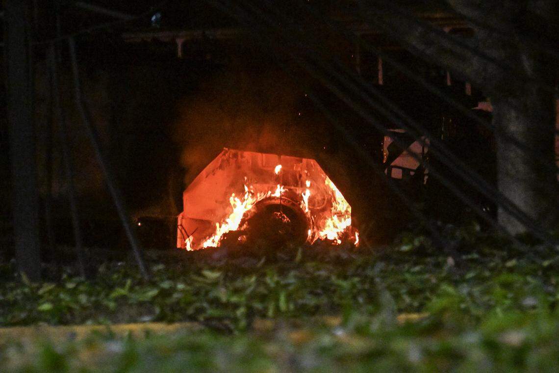 A vehicle burns at La Carlota air base in Caracas after a series of explosions on Jan. 3, 2026. Loud explosions, accompanied by sounds resembling aircraft flyovers, were heard in Caracas around 2 a.m. on Jan. 3. The Venezuelan government blamed the U.S. for carrying out a series of attacks.