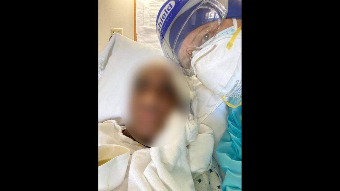 Nursing assistant Niurka Solano and a resident at Fair Havens nursing home.