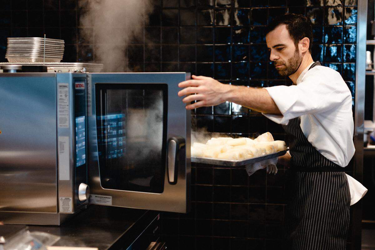 Chef Miguel Massens is at the demo kitchen at Time Out Market Miami.