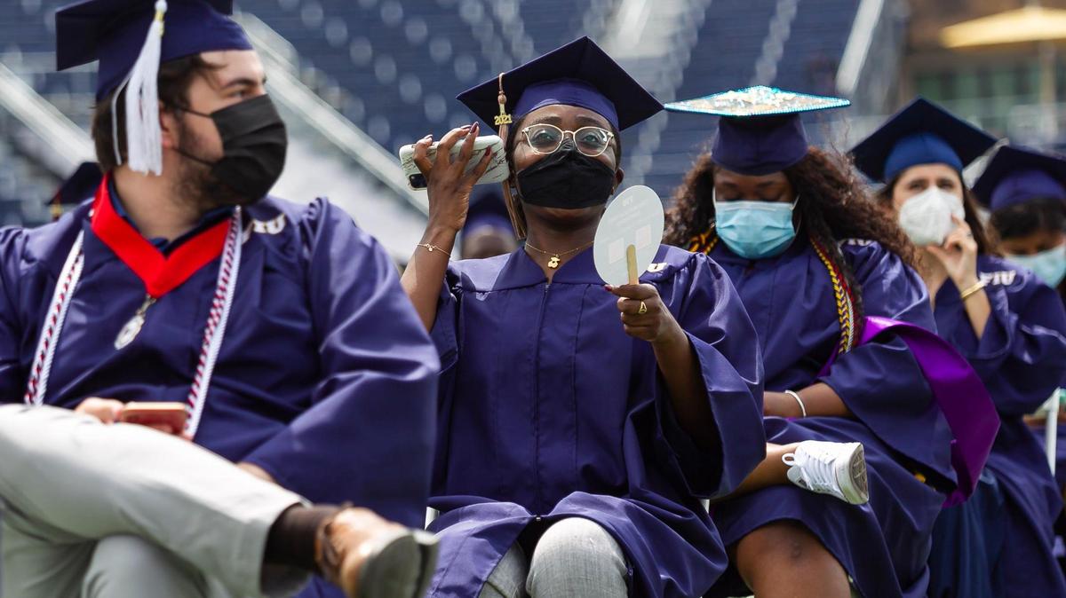 Florida International University students attend their graduation ceremony inside the Riccardo Silva Stadium in Miami, Florida on Saturday, April 24, 2021. A Miami-Dade circuit judge refused to dismiss a suit against FIU that seeks refunds of fees collected from students when the university’s campus was shut down in 2020 due to coronavirus.