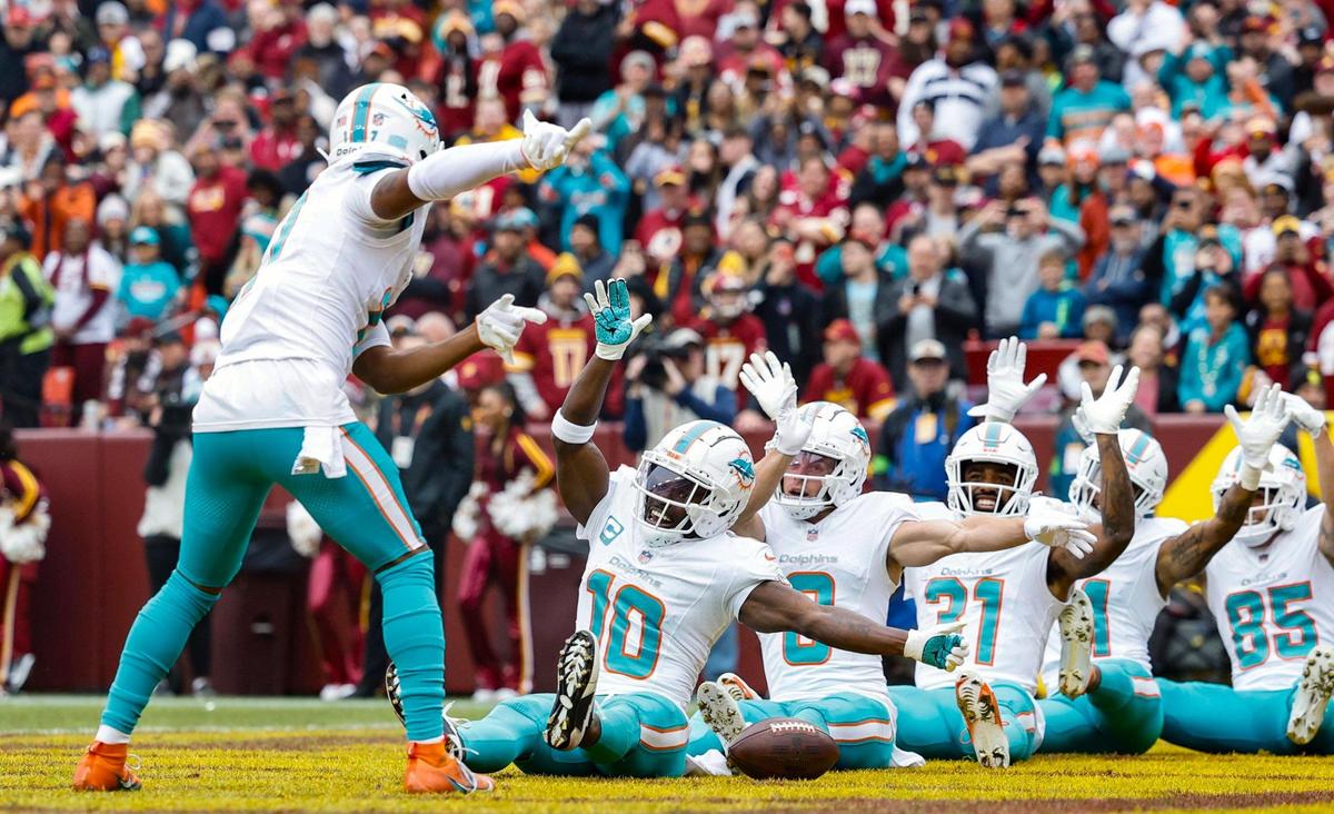 Miami Dolphins wide receiver Jaylen Waddle (17) leads the team as they react after wide receiver Tyreek Hill (10) scores in the first quarter during the game against the Washington Commanders at FedEx Field in Landover, Maryland on Sunday, December 3, 2023.