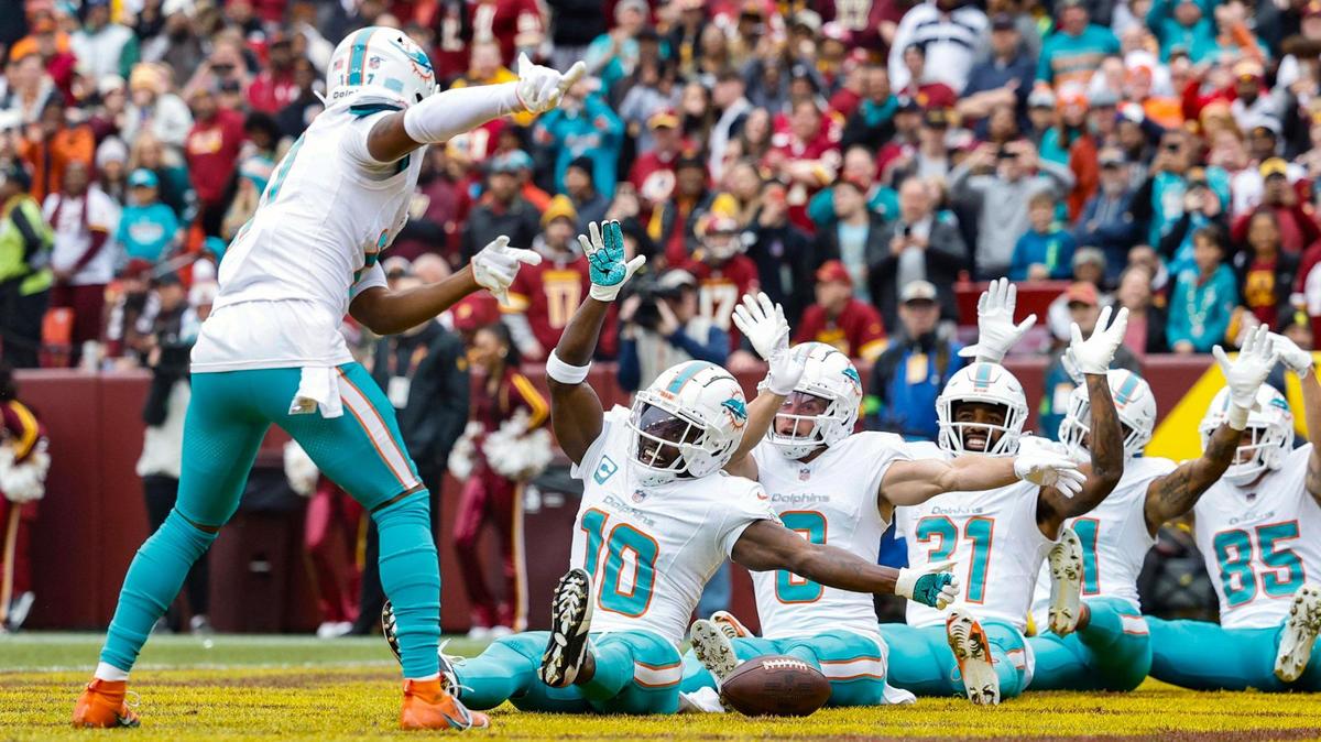 Miami Dolphins wide receiver Jaylen Waddle (17) leads the team as they react after wide receiver Tyreek Hill (10) scores in the first quarter during the game against the Washington Commanders at FedEx Field in Landover, Maryland on Sunday, December 3, 2023.