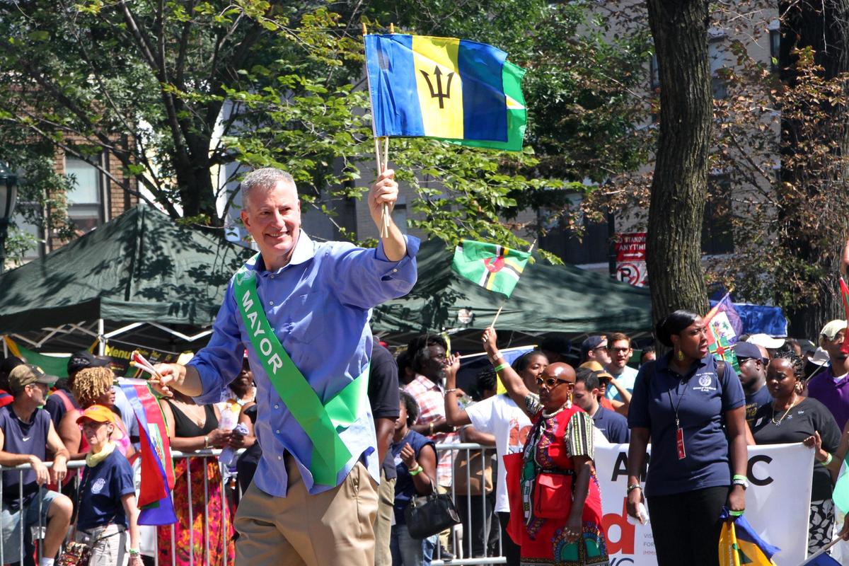 In this Sept. 7, 2015, file photo, Mayor Bill de Blasio, foreground, makes his way along Eastern Parkway in the Brooklyn borough of New York as he takes part in the West Indian Day Parade.