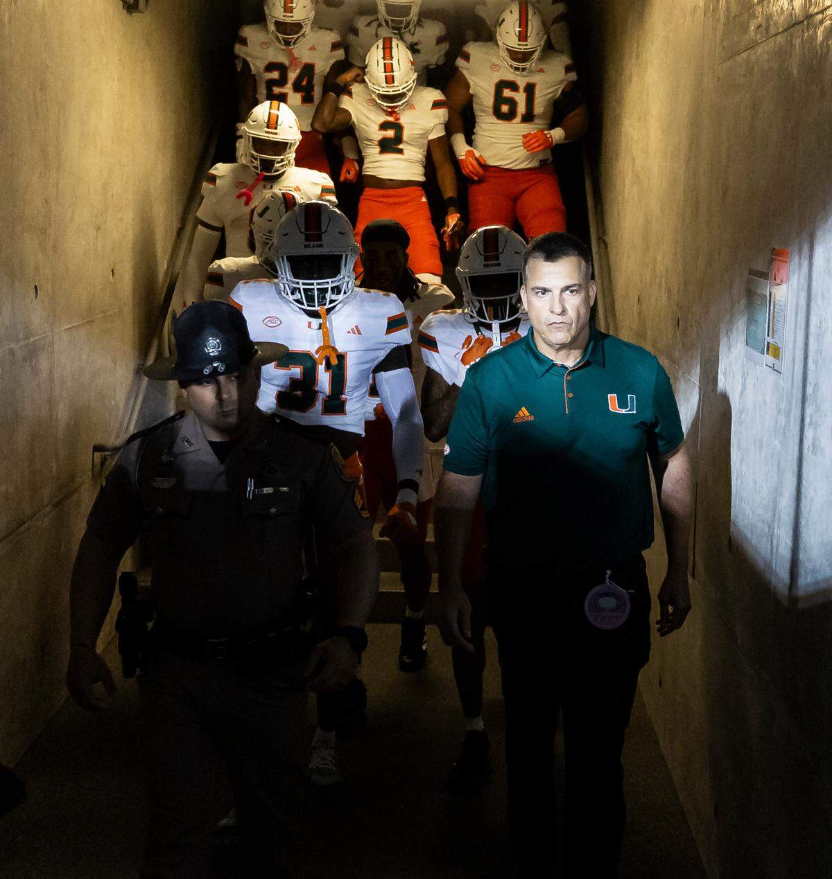 Miami Hurricanes head coach Mario Cristobal leads his team to the field before their NCAA college football game against the California Golden Bears at the California Memorial Stadium on Saturday, Oct. 5, 2024, in Berkeley, Calif.