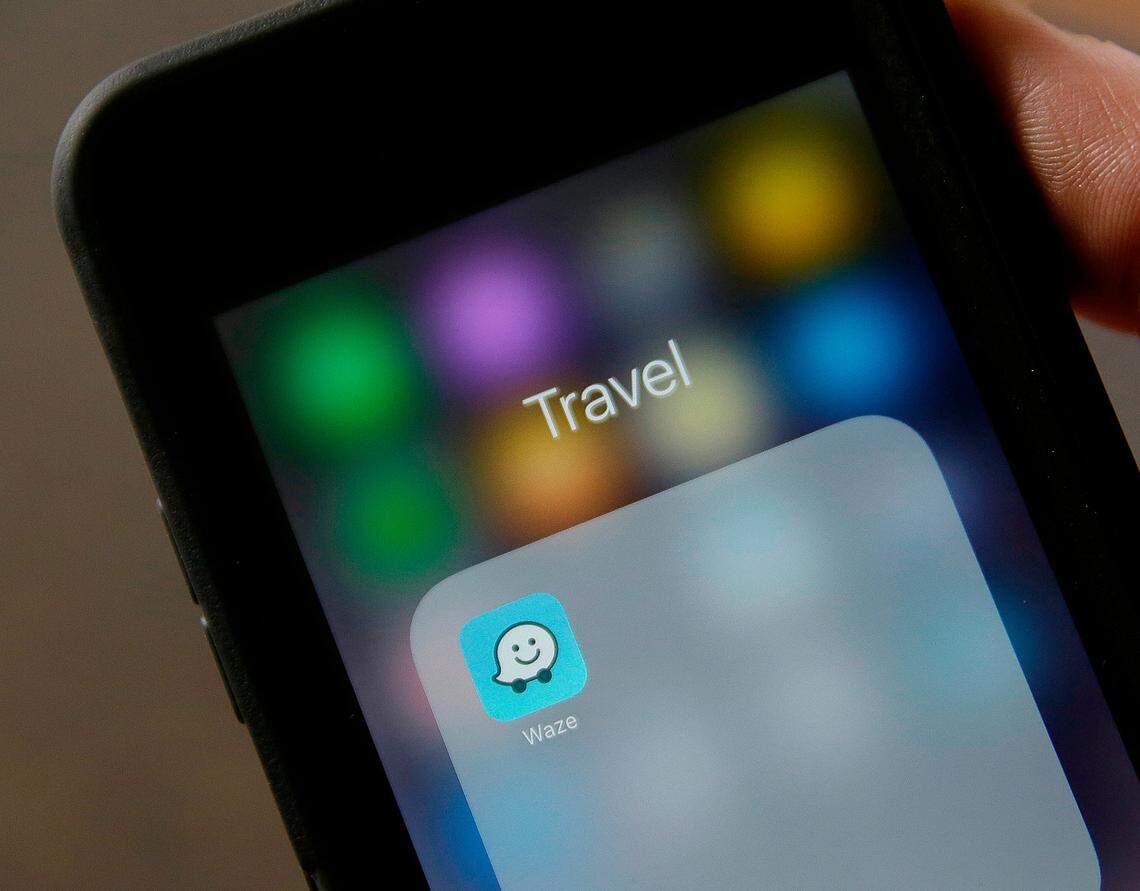 The Waze application is displayed on a smartphone in San Francisco.