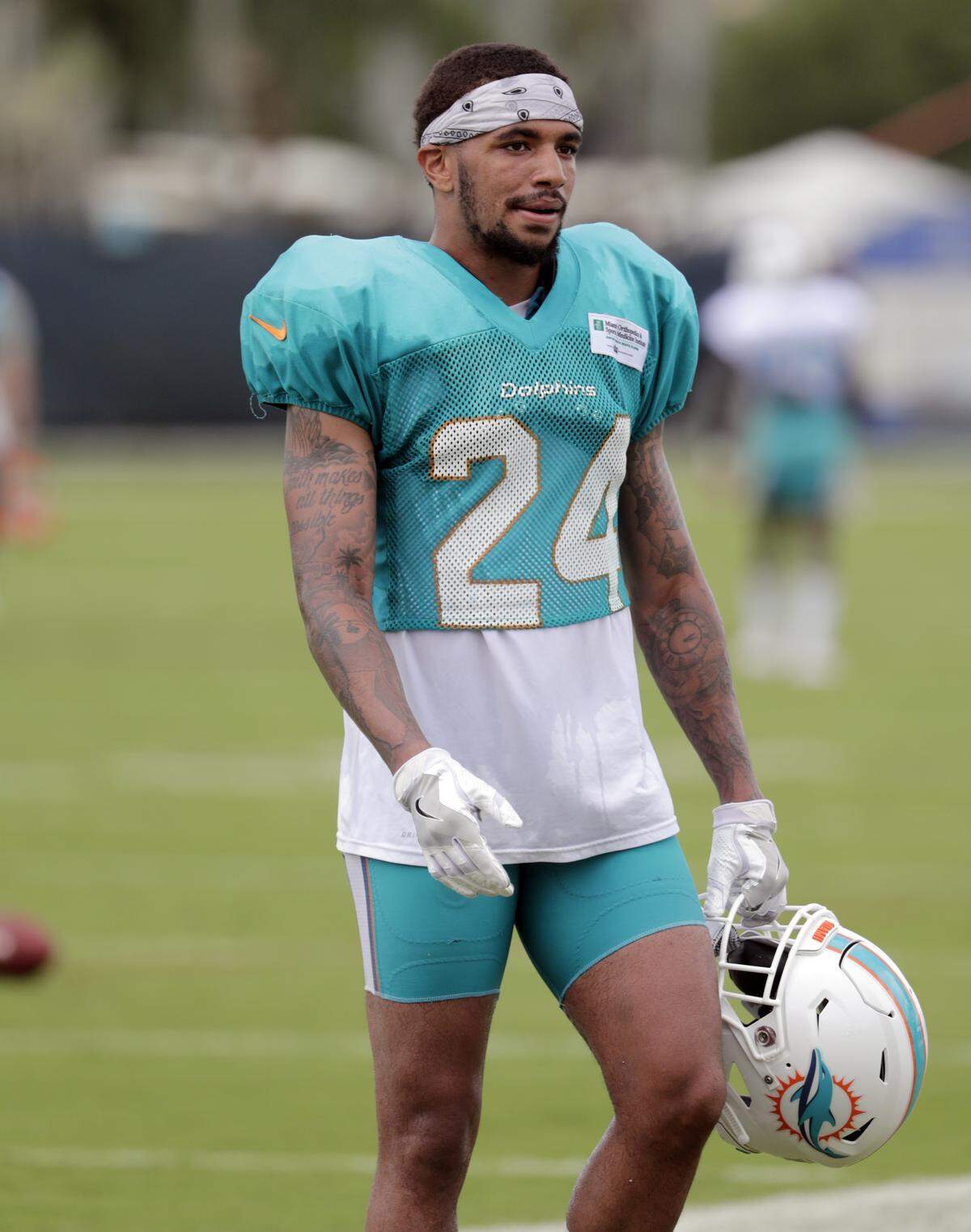 Miami Dolphins cornerback Torry McTyer walks off the field at the NFL football team’s training camp, Wednesday, Aug. 1, 2018, in Davie, Fla. (AP Photo/Lynne Sladky)