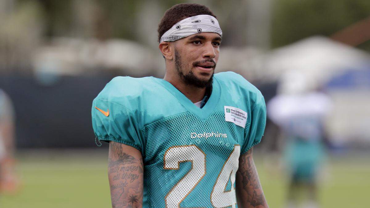 Miami Dolphins cornerback Torry McTyer walks off the field at the NFL football team’s training camp, Wednesday, Aug. 1, 2018, in Davie, Fla. (AP Photo/Lynne Sladky)
