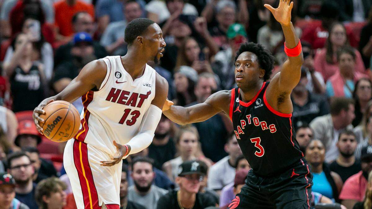 Miami Heat center Bam Adebayo (13) drives the ball past Toronto Raptors forward O.G. Anunoby (3) during the second half of an NBA basketball game at FTX Arena on Monday, Oct. 24, 2022, in Miami, Fla.