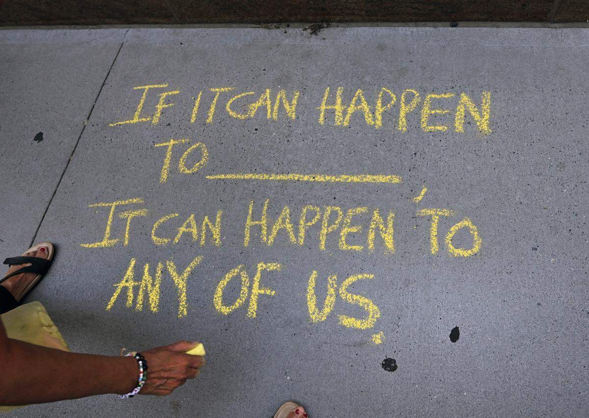 A protest is held outside the Jacob K. Javits Federal Building in New York as ICE agents and federal officers detain migrants after they attend hearings at immigration court in the building, July 24, 2025. 