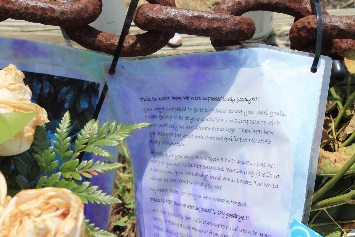 An essay written by a classmate of Pascal Weisberger is displayed at a memorial for the boy in front of Treasure Village Montessori School Tuesday, May 20, 2020. Weisberger was killed in a knife attack May 7, 2020. Police say his brother is the only suspect in his death.