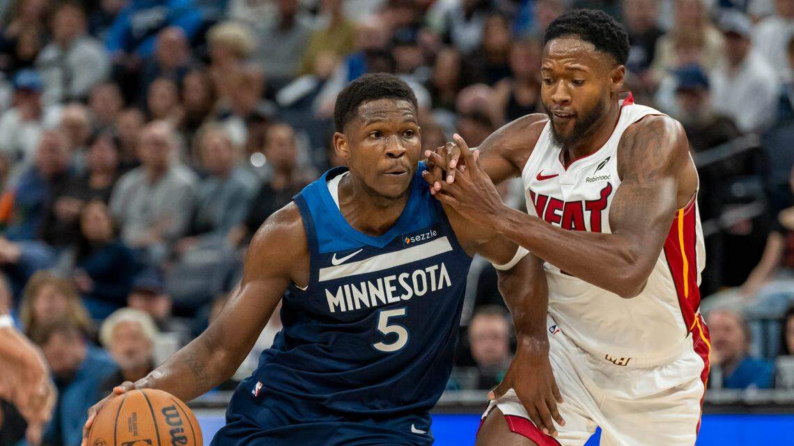 Minnesota Timberwolves guard Anthony Edwards (5) drives to the basket past Miami Heat forward Haywood Highsmith (24) in the first half at Target Center.