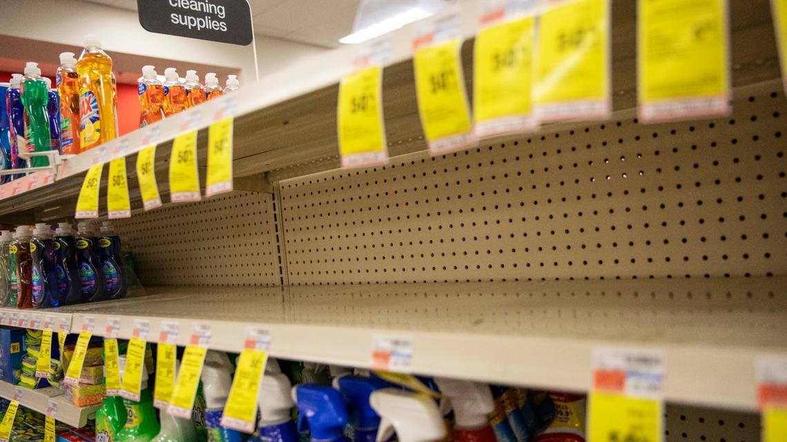 FILE - In this March 4, 2020 file photo, shelves where disinfectant wipes and sprays are usually displayed sit empty in a pharmacy in Providence, R.I. Now, the CDC says cleaning is usually enough to protect against COVID-19 transmission through surfaces and that disinfecting is only necessary in some circumstances. (AP Photo/David Goldman, File)