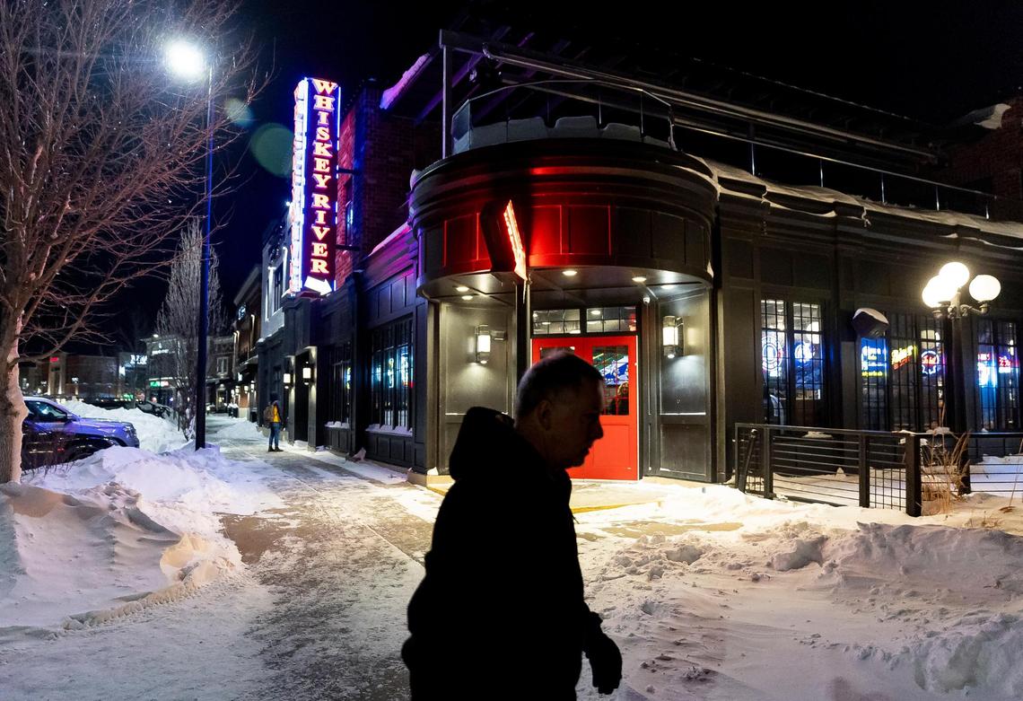 A man walks near The District Venue before the start of a Ron DeSantis rally on Sunday, Jan. 14, 2023, in Ankeny, Iowa. DeSantis is hoping for a strong performance in the Iowa caucuses.