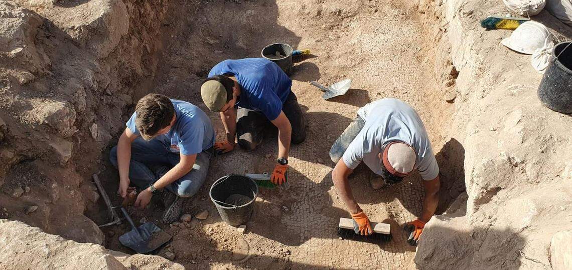 Archaeologists excavating the site.