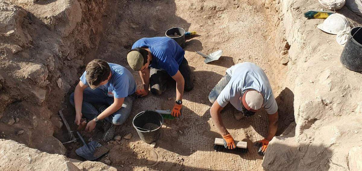 Archaeologists excavating the site.