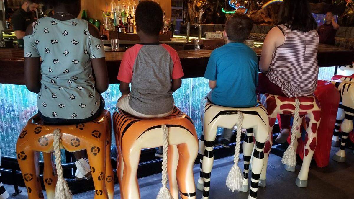 Amanda Williams Cruce and Deena Ruth Cruce had five foster kids in their home in September 2018. Here are four on a restaurant outing.