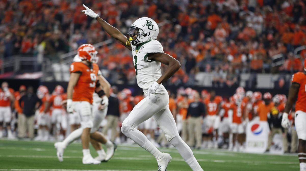 Baylor wide receiver Tyquan Thornton (9) celebrates scoring a touchdown against Oklahoma State in the first half of an NCAA college football game for the Big 12 Conference championship in Arlington, Texas, Saturday, Dec. 4, 2021. (AP Photo/Tim Heitman)