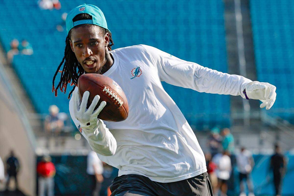 Miami Dolphins wide receiver Daewood Davis (87) catches a pass during warmups before the game against the Jacksonville Jaguars at EverBank in Jacksonville, Florida on Saturday, August 26, 2023.