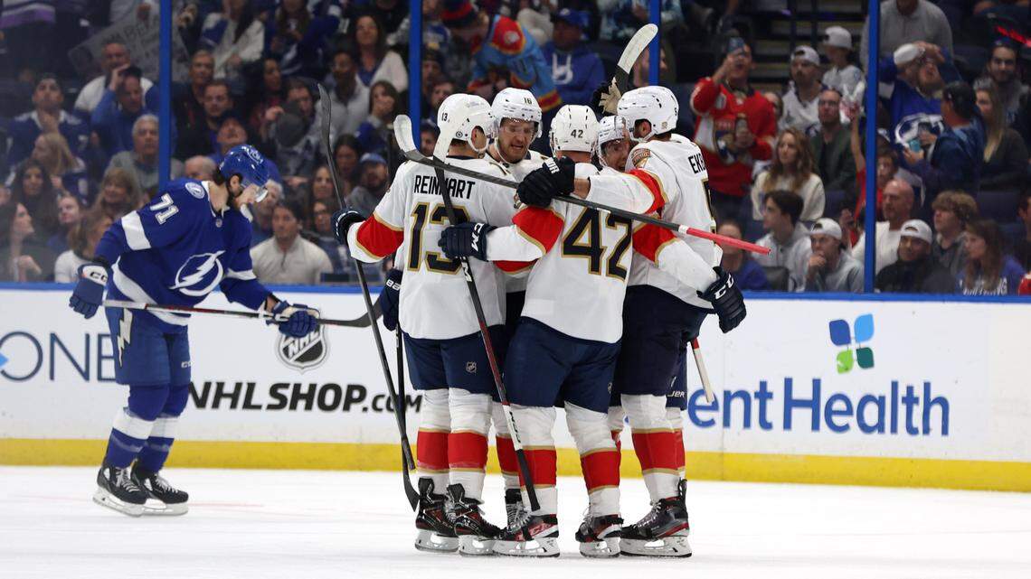 Dec 27, 2023; Tampa, Florida, USA; Florida Panthers defenseman Aaron Ekblad (5) is congratulated after he scored a goal against the Tampa Bay Lightning during the first period at Amalie Arena. Mandatory Credit: Kim Klement Neitzel-USA TODAY Sports