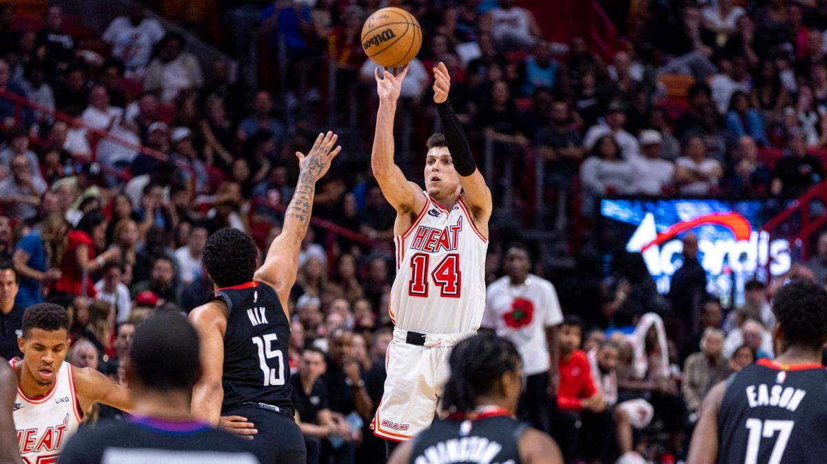 Miami Heat guard Tyler Herro (14) shoots over Houston Rockets guard Daishen Nix (15) during the third quarter of an NBA game at Miami-Dade Arena in Downtown Miami on Friday, February 10, 2023.