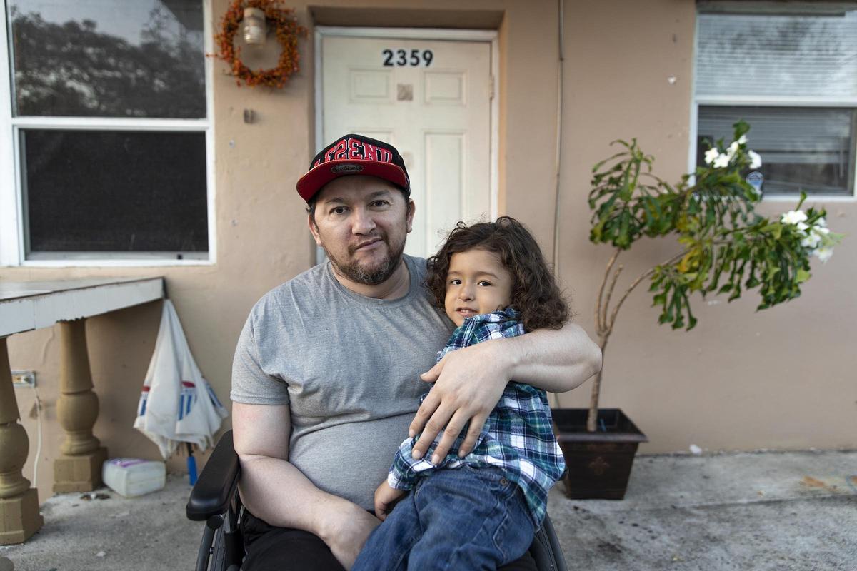 Jonathan Vaquiz (right) , 3, has chronic lung disease, heart disease, and also has DiGeorge syndrome, which is a chromosomal disorder that results in poor development of several body systems. His dad (left) suffered a head trauma and is now both in a wheelchair and paralyzed; Jonathan’s family is struggling with the basics.