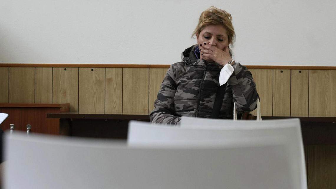 Alessandra Travaglini of Milan, Italy, is out of work and struggling even more now with the lack of cheap Russian energy. Her utility bill doubled to more than 120 euros a month, and she hopes a local church can give her help.