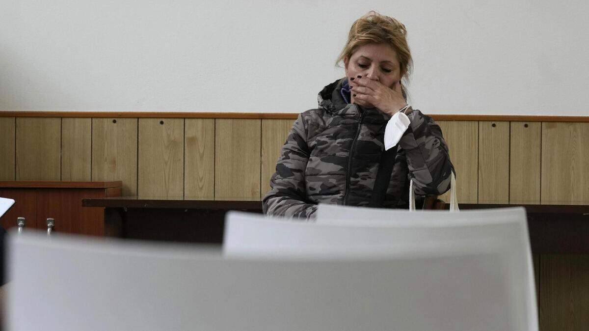 Alessandra Travaglini of Milan, Italy, is out of work and struggling even more now with the lack of cheap Russian energy. Her utility bill doubled to more than 120 euros a month, and she hopes a local church can give her help.