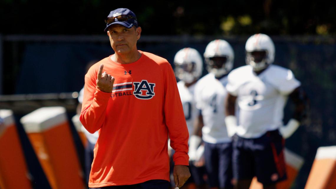 Auburn defensive coordinator Kevin Steele summons a couple players to him in NCAA college football practice on Monday, July 31, 2017, in Auburn, Ala. (Todd J. Van Emst/Opelika-Auburn News via AP)