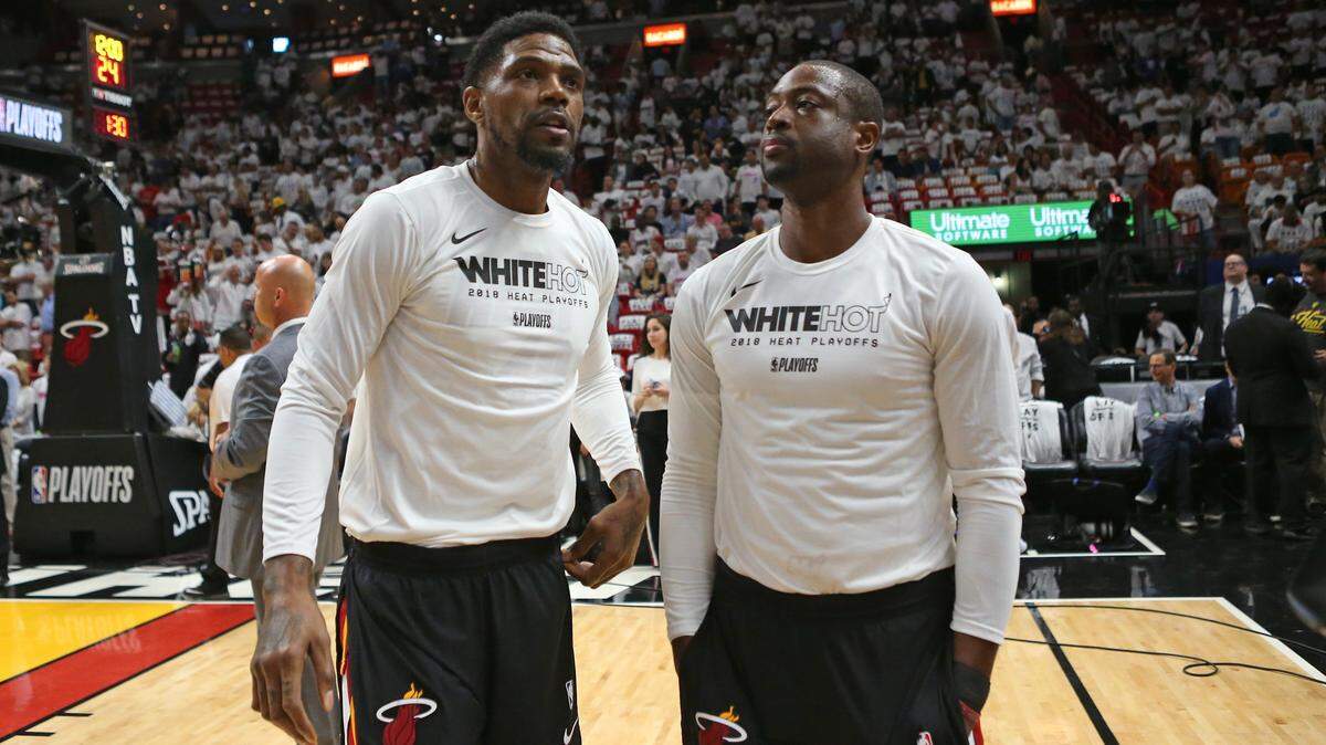 Miami Heat players Udonis Haslem and Dwyane Wade talks on before the start of Game 3 of a first-round NBA basketball playoff series at AmericanAirlines Arena in Miami on Thursday, April 19, 2018.