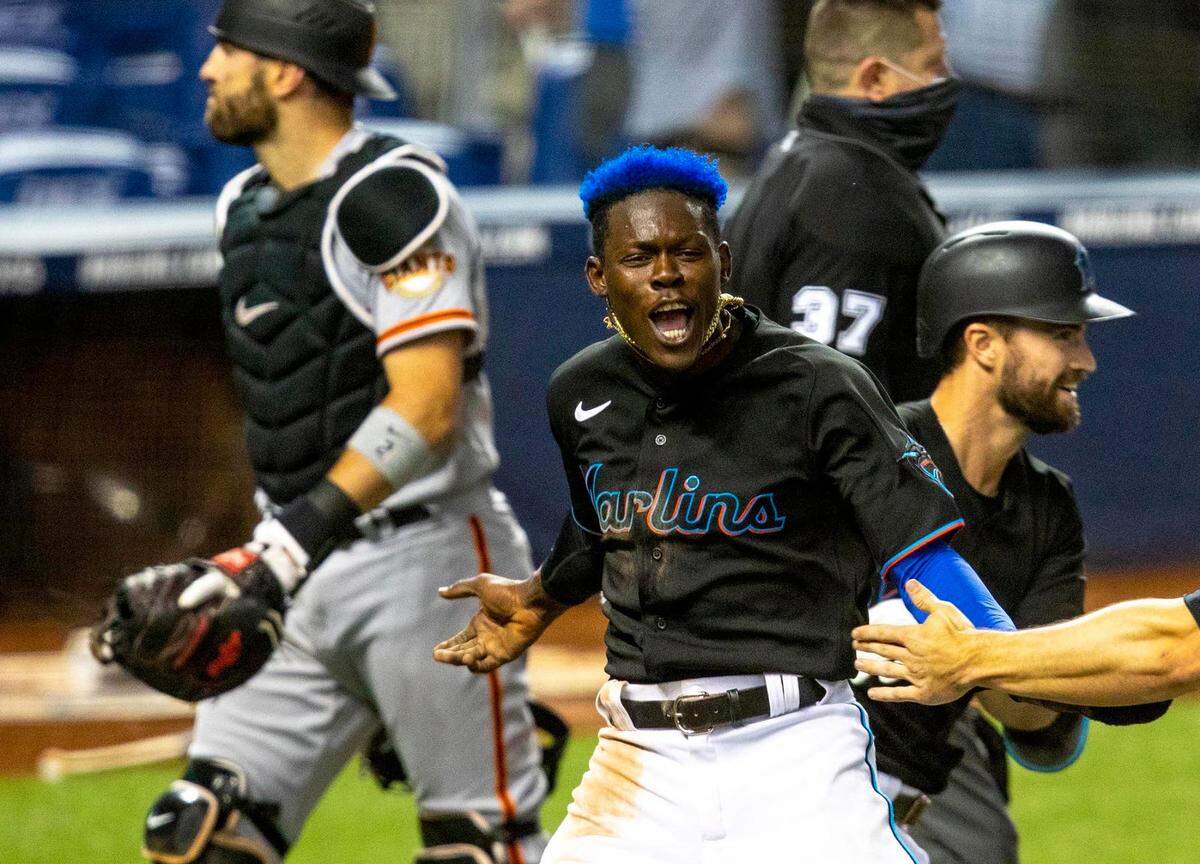 Miami Marlins infielder Jazz Chisholm Jr.†(2) reacts after scoring off a Jorge Alfaro (38) double in the tenth inning of an MLB game against the San Francisco Giants at loanDepot park in the Little Havana neighborhood of Miami, Florida, on Saturday, April 17, 2021.