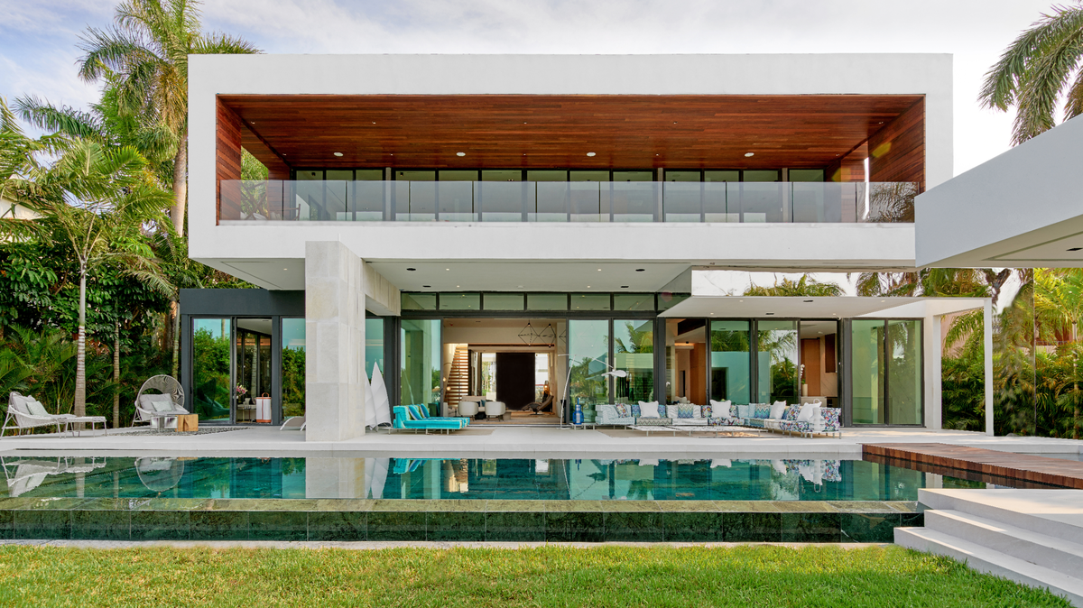 An undisclosed California buyer spent $29.5 million on the 2-story single-family home at 135 Palm Ave. Above: A look outside of the modern residence overlooking Biscayne Bay.