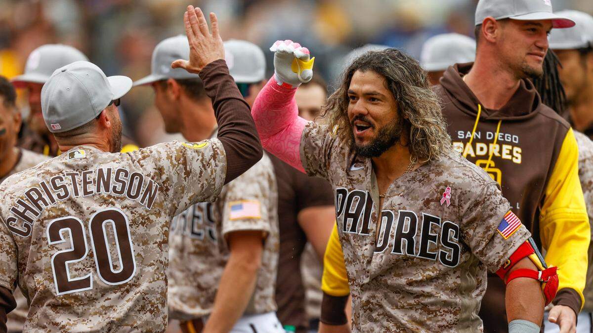 San Diego Padres’ Jose Alfaro, front right, celebrates with bench coach Ryan Christenson after hitting a three-run walkoff home run against the Miami Marlins during the ninth inning of a baseball game Sunday, May 8, 2022, in San Diego. (AP Photo/Mike McGinnis)