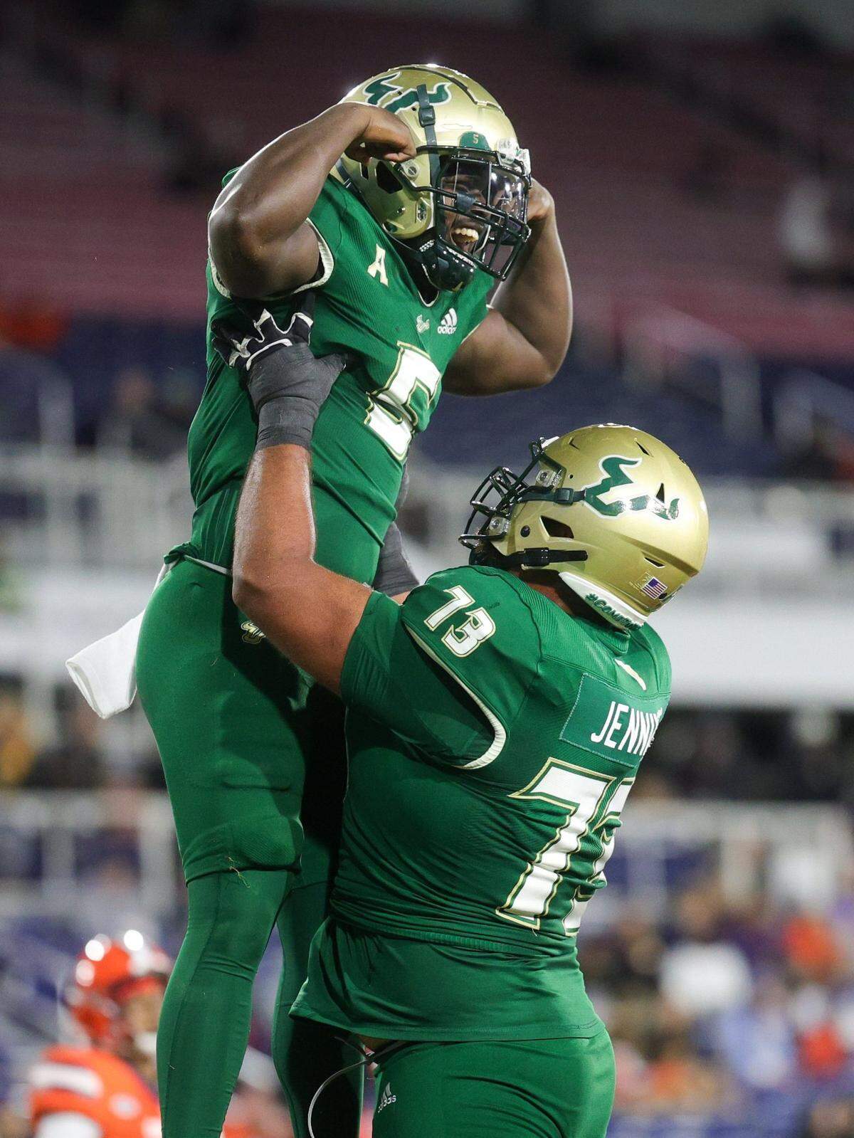 Dec 21, 2023; Boca Raton, FL, USA; South Florida Bulls running back Nay’Quan Wright (5) celebrates with offensive lineman Donovan Jennings (73) after scoring a touchdown against the Syracuse Orange in the fourth quarter during the RoofClaim.com Boca Raton Bowl at FAU Stadium. Mandatory Credit: Nathan Ray Seebeck-USA TODAY Sports